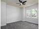 Comfortable bedroom with plush carpet and a window offering natural light at 742 Olde Towne Ln, Marietta, GA 30068