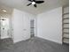 Well-lit bedroom includes a ceiling fan, built-in shelving and easy access to the bathroom and hallway at 742 Olde Towne Ln, Marietta, GA 30068