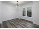 Bright dining room with hardwood floors, white walls, and large windows, perfect for entertaining at 742 Olde Towne Ln, Marietta, GA 30068