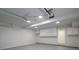 Clean, organized garage with white walls, gray epoxy floor and white storage cabinets at 742 Olde Towne Ln, Marietta, GA 30068