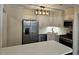 Stylish kitchen with stainless appliances, quartz counters, modern lighting, and ample storage at 742 Olde Towne Ln, Marietta, GA 30068