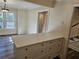 Kitchen island with ample counter space, drawers, and seating, perfect for meal prep and casual dining at 742 Olde Towne Ln, Marietta, GA 30068