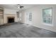 Spacious living room with a fireplace, built-in bookshelves, and French doors leading to the exterior at 742 Olde Towne Ln, Marietta, GA 30068