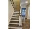 A beautiful staircase with hardwood steps and a white banister leads to the upper level of the home at 742 Olde Towne Ln, Marietta, GA 30068