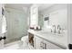 Modern bathroom featuring a glass-enclosed shower, sleek fixtures, and a bright vanity area at 10594 Serenbe Ln, Chattahoochee Hills, GA 30268