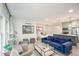 Open living space with a modern kitchen, comfortable seating, and a bed with white linens at 10594 Serenbe Ln, Chattahoochee Hills, GA 30268