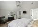 Spacious main bedroom with an ensuite bathroom, hardwood floors, and ample natural light at 10594 Serenbe Ln, Chattahoochee Hills, GA 30268