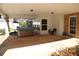 Spacious back patio with room for entertaining and covered outdoor area at 575 Midland Park Dr, Stone Mountain, GA 30087