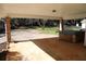 Covered back patio with room for outdoor entertaining, views of backyard and green space at 575 Midland Park Dr, Stone Mountain, GA 30087