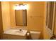 Bright bathroom featuring a vanity with marble countertop and a framed mirror at 575 Midland Park Dr, Stone Mountain, GA 30087
