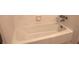 Clean, classic white bathtub with tiled walls and chrome fixtures at 575 Midland Park Dr, Stone Mountain, GA 30087