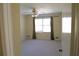 Neutral bedroom with a large window providing natural light and carpeted floor at 575 Midland Park Dr, Stone Mountain, GA 30087