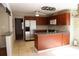 Well-equipped kitchen with stainless steel fridge and ample cabinet space at 575 Midland Park Dr, Stone Mountain, GA 30087