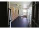 The sunroom showcases brick walls, tiled flooring, a ceiling fan, and glass windows at 575 Midland Park Dr, Stone Mountain, GA 30087