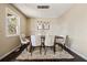 Bright dining room featuring a modern chandelier, a dark wood table, and seating for six at 2749 Hawk Ne Trce, Marietta, GA 30066