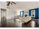 Open-concept living room with hardwood floors, a vaulted ceiling, and neutral-colored furniture at 2749 Hawk Ne Trce, Marietta, GA 30066