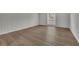 Bedroom features wood floors, neutral paint, and a window with diamond pattern at 3183 Abbeywood Dr, Decatur, GA 30034