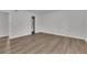 This bedroom features wood flooring and an open closet for storage at 3183 Abbeywood Dr, Decatur, GA 30034