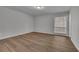 This bedroom features wood flooring and a window with diamond-patterned trim at 3183 Abbeywood Dr, Decatur, GA 30034