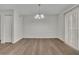 Dining area with sliding glass doors, updated lighting, and wood floors offers access to the patio at 3183 Abbeywood Dr, Decatur, GA 30034