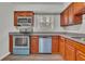 Features the kitchen's stainless steel appliances, ample counter space and beautiful cabinetry at 3183 Abbeywood Dr, Decatur, GA 30034