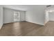 A bright living room featuring wood floors, a window with diamond pattern, and neutral paint at 3183 Abbeywood Dr, Decatur, GA 30034