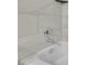 This shower area features elegant marble-look tiles and chrome fixtures at 3183 Abbeywood Dr, Decatur, GA 30034
