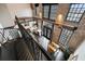 High-angle view of kitchen and dining area, showing the spiral staircase and exposed brick walls at 5434 Peachtree Rd # 115, Chamblee, GA 30341