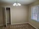 Neutral bedroom with natural light, carpet flooring, overhead lighting, and a closet at 130 Willow Shoals Dr, Covington, GA 30016