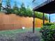 View of backyard, with the fence line bordered by evergreens at 132 Wetherbrooke Ln # 3, Smyrna, GA 30082