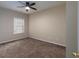 Bedroom featuring carpeted floors, a window, a ceiling fan, and neutral walls at 132 Wetherbrooke Ln # 3, Smyrna, GA 30082