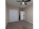 Neutral bedroom featuring plush carpeting, ceiling fan, and closet at 132 Wetherbrooke Ln # 3, Smyrna, GA 30082