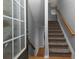 Inviting entryway with a staircase, wooden floors, grey walls, and natural light streaming through the front door at 132 Wetherbrooke Ln # 3, Smyrna, GA 30082