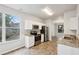 Modern kitchen featuring white cabinets, granite countertops, stainless steel appliances, and ample natural light at 2704 River Summit Ln, Decatur, GA 30034