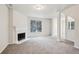 Spacious living room showcasing neutral walls, carpeting, and a cozy fireplace at 2704 River Summit Ln, Decatur, GA 30034