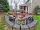 Backyard patio with a fire pit, chairs, and a Big Green Egg at 2751 Davis Rd, Marietta, GA 30062