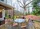 Spacious backyard featuring a fire pit, wood deck with comfortable chairs, perfect for entertaining at 2751 Davis Rd, Marietta, GA 30062