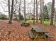 Leaf-covered backyard with picnic tables at 2751 Davis Rd, Marietta, GA 30062