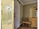 Bathroom featuring tiled walk-in shower with glass door and a sliding barn door at 2751 Davis Rd, Marietta, GA 30062