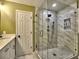 Bathroom showcasing a walk-in shower with glass door and a marble-look surround at 2751 Davis Rd, Marietta, GA 30062