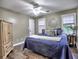 Bedroom with a bed dressed in blue bedding and hardwood flooring at 2751 Davis Rd, Marietta, GA 30062