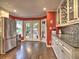 Bright dining area featuring stainless refrigerator, wine rack, and views of the backyard at 2751 Davis Rd, Marietta, GA 30062