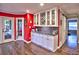 Inviting dining area with built-in cabinets, wine rack, and door to the backyard at 2751 Davis Rd, Marietta, GA 30062