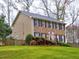 Charming brick two-story home with mature trees, manicured lawn, and an inviting facade at 2751 Davis Rd, Marietta, GA 30062