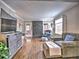 Cozy living room with a fireplace, comfortable seating, hardwood floors, and natural light at 2751 Davis Rd, Marietta, GA 30062