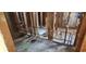 Bathroom renovation showcasing wooden framing, plumbing, and electrical wiring at 3005 Flat Shoals Rd, Atlanta, GA 30349