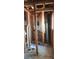 Framing of gutted bathroom revealing pipes, wiring, and stud structure at 3005 Flat Shoals Rd, Atlanta, GA 30349