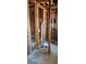 Framing of bathroom renovation showing pipes, framing, and unfinished construction at 3005 Flat Shoals Rd, Atlanta, GA 30349