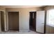 Bedroom with an empty closet space and door, showcasing the need for renovation at 3005 Flat Shoals Rd, Atlanta, GA 30349