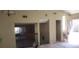 Shows the living room has stairs with brown leaves outside the open door at 3005 Flat Shoals Rd, Atlanta, GA 30349